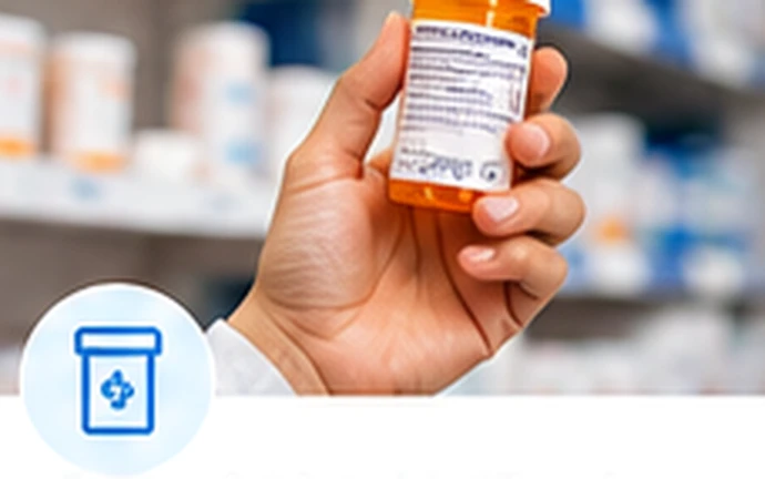 Prescription medication bottle being held in a pharmacy setting